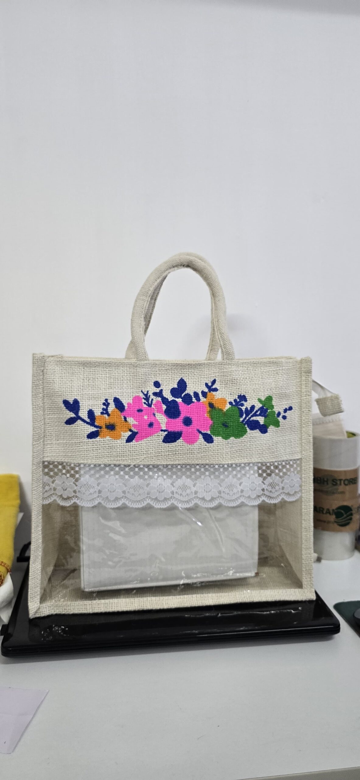 Floral design jute gift hamper bag with window and lace